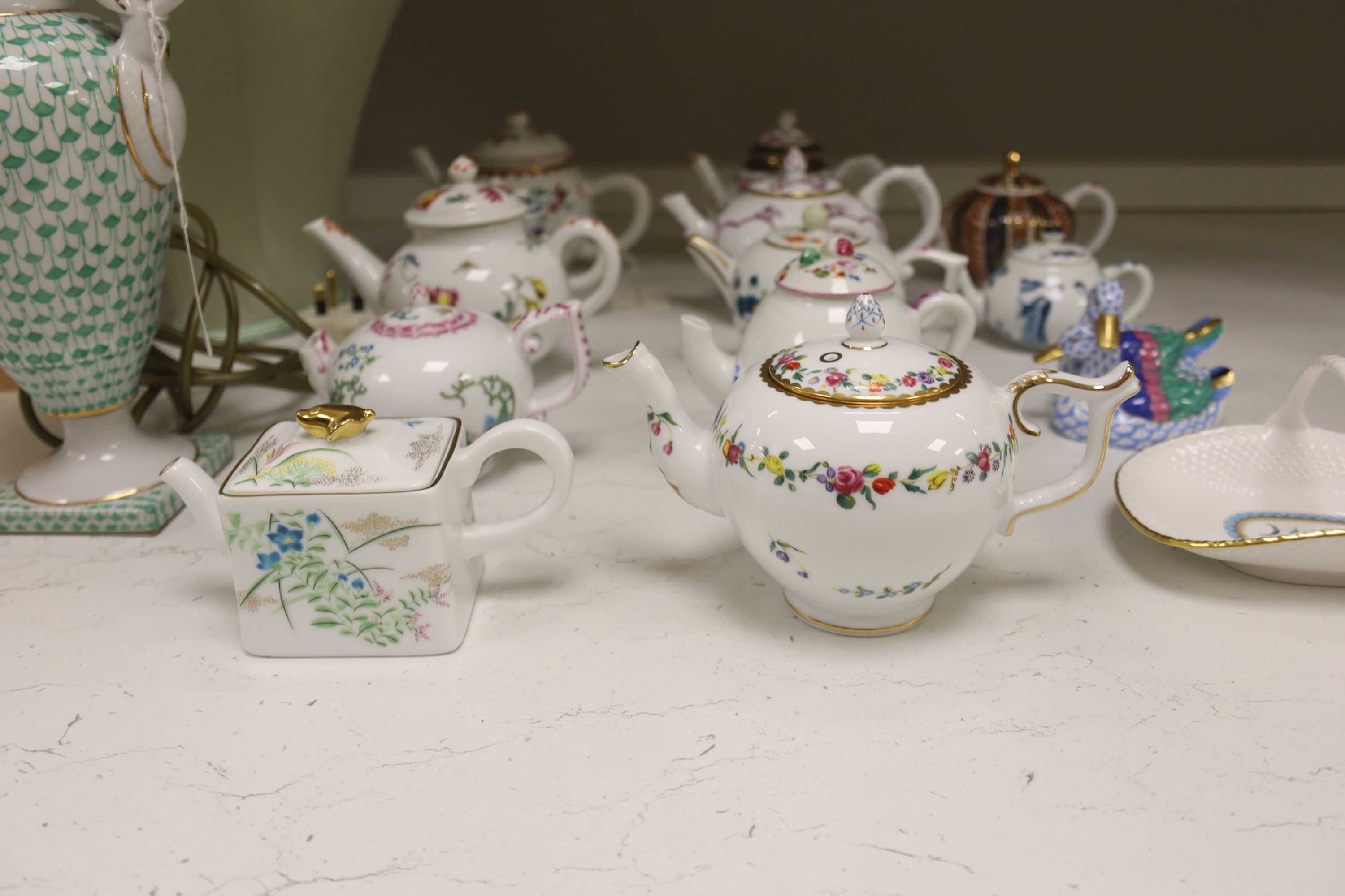 Twelve modern floral-decorated collectors' teapots (V&A Museum Collection), a Spode dish, a table lamp and a Herend duck group (15)